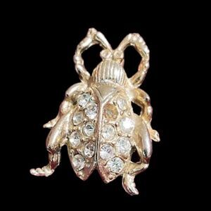 Diamanté Gold tone beetle brooch